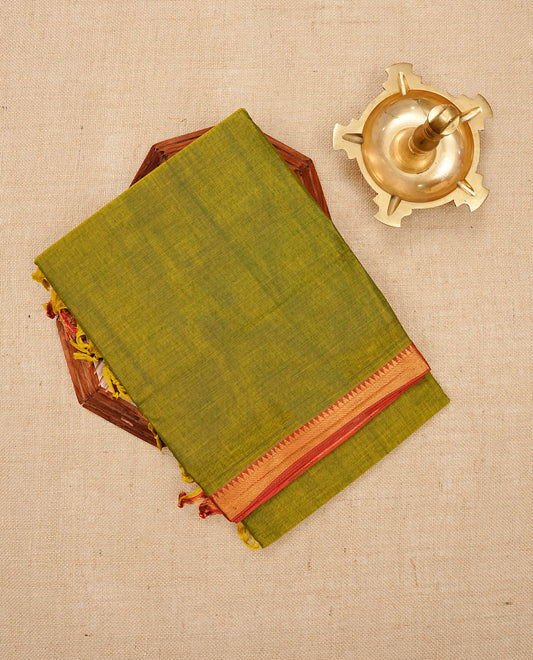 Lime Green colour Narayanapattu cotton saree with a plain body, complemented by a brick red colour with Gold Zari border & contrast pallu, paired with a matching blouse piece.