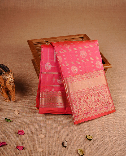 Brick red colour traditional kancheepuram silk saree featuring gold zari check pattern on body, complemented by self colour with gold zari traditional border, paired with matching blouse piece.