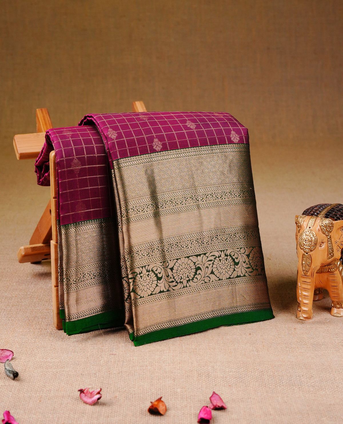 Magenta Colour Traditional Kancheepuram Silk Saree with Gold Zari Checks and Floral Buttas on the Body, Enhanced with a Contrast Green Colour  with Grand Gold Zari Border and Rich Pallu, Paired with a Matching Blouse Piece.
