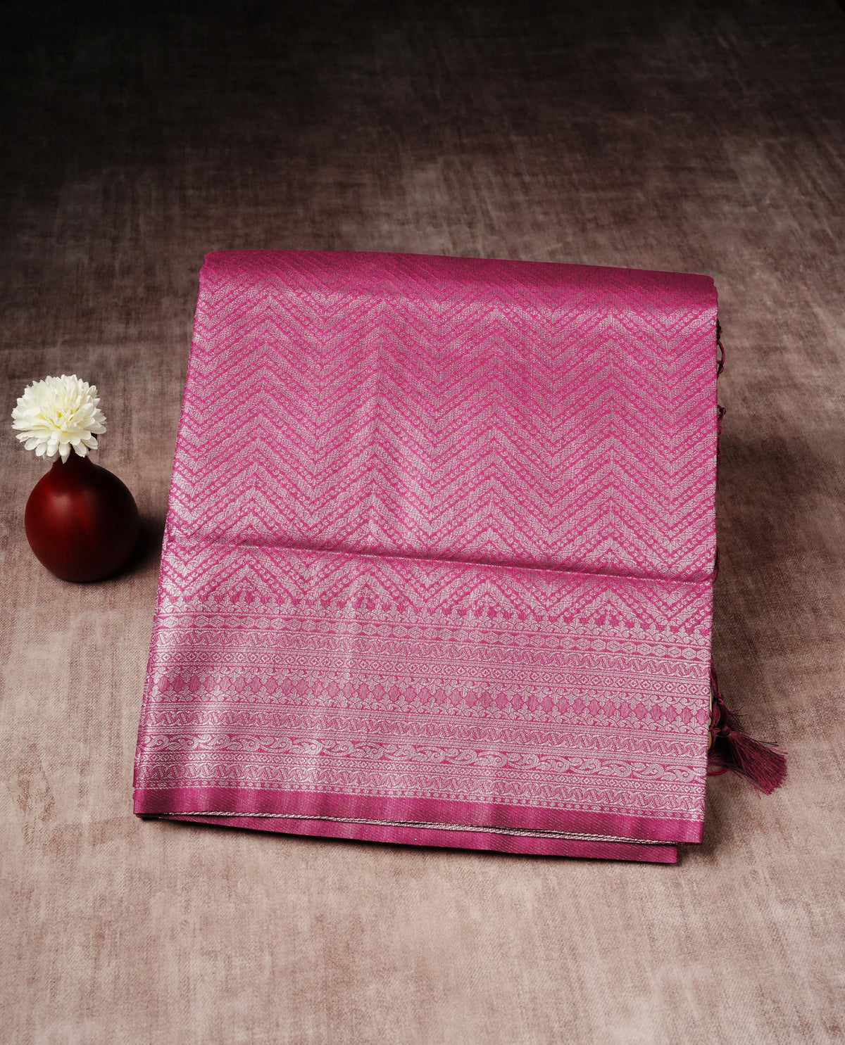 Magenta colour softie silk saree featuring silvar zari, rich pallu floral pattern brocade body, with contrasting self colour border.paired with matching blouse piece.
