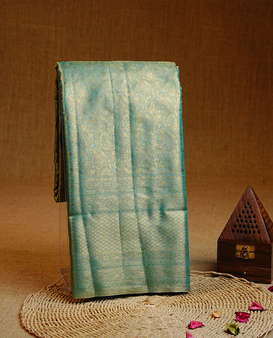 Green & Gold colour Double shade Semi tissue silk saree featuring self color kodi pattern on body, self colour with traditional border, paired with matching blouse piece.