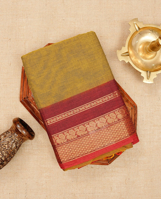 Dark mustard colour chettinad cotton saree featuring elegant plain body, Contrast Red colour with Gold zari border, comes with matching blouse piece.