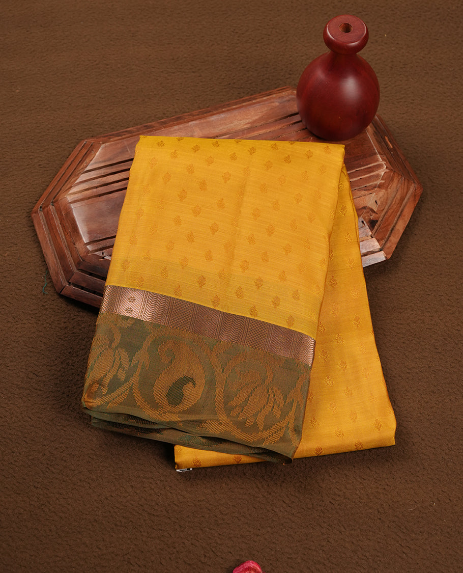 Yellow colour soft silk saree featuring stripes on the body, complemented by a contrast Green zari border and pallu, paired with matching blouse piece.