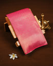 Rani pink colour soft silk saree featuring gold zari zig zag & floral kodi pattern on body, complemented by self colour with traditional border, paired with matching blouse piece.