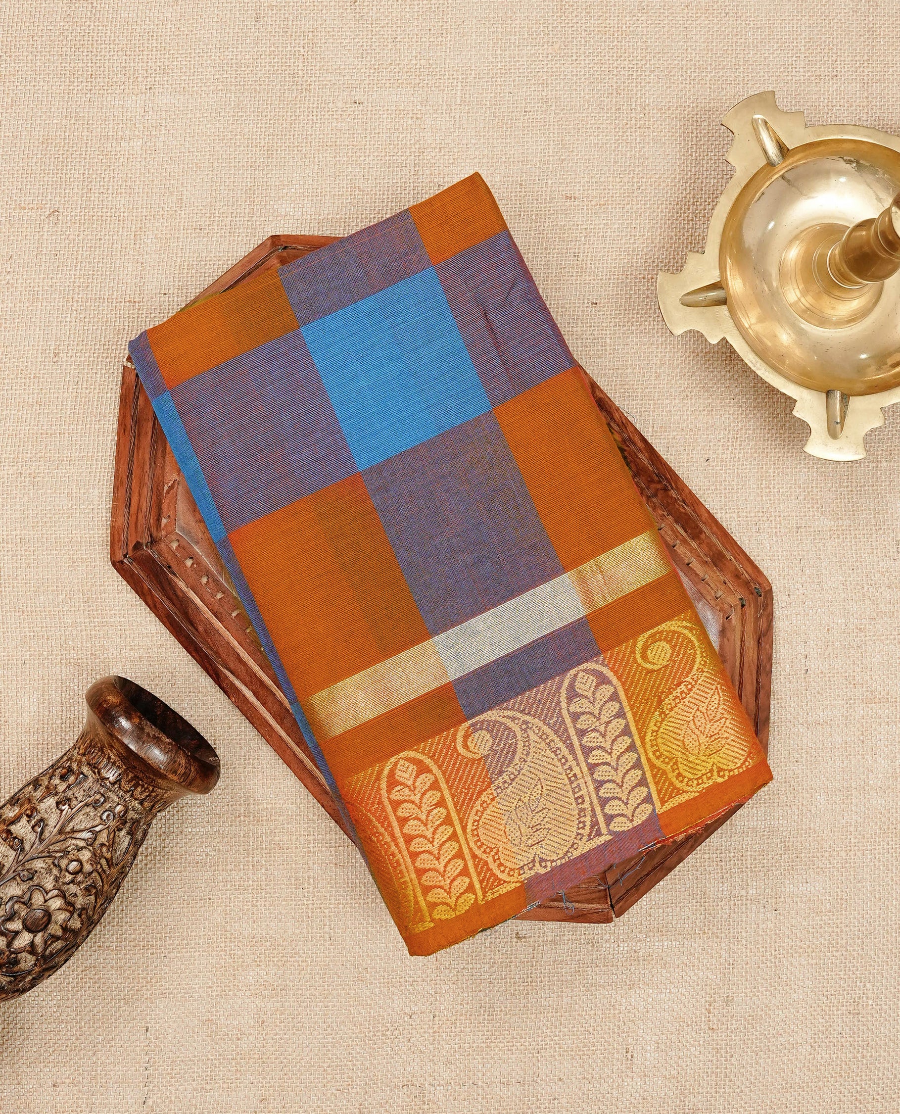Rust orange & Blue colour Chettinad cotton saree featuring a check pattern on the body, complemented by a self-colour gold zari border, comes with a matching blouse piece