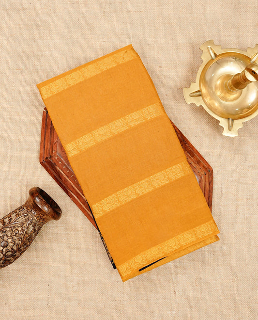 Mustard yellow Sungudi cotton saree featuring elegant gold zari striped Peacock pattern across the body, complemented by a contrast border. Paired with a matching blouse piece