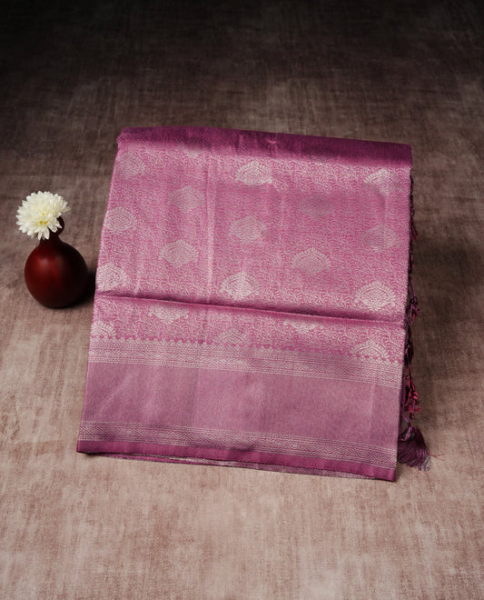Onion pink colour softie silk saree featuring silver zari, rich pallu floral pattern brocade body, with contrasting self colour border.paired with matching blouse piece.