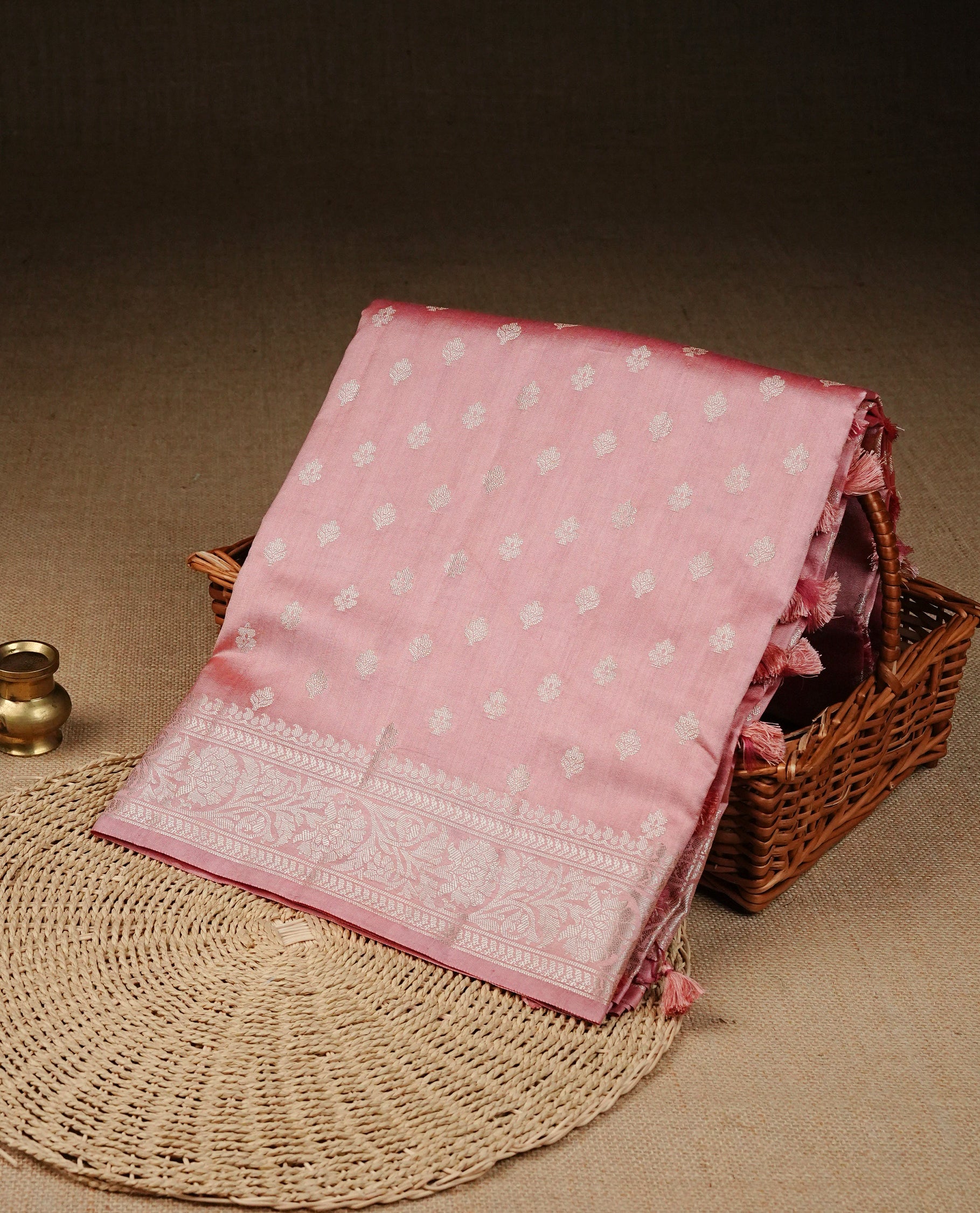 Peach Pink Colour  Tussar silk saree with silver zari buttas On Body, an elegant zari border and pallu, Paired With a matching blouse piece.