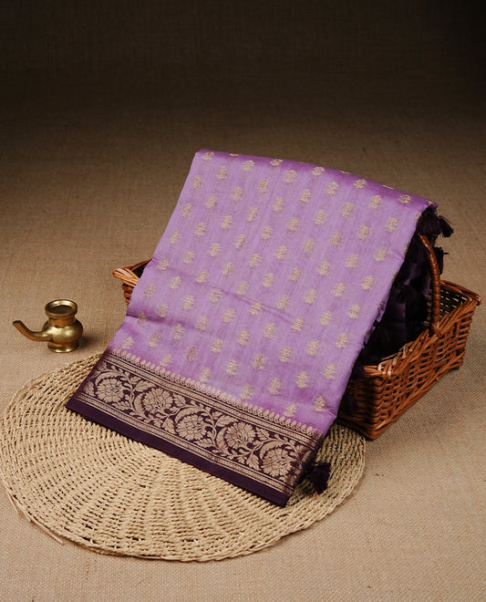 Lavender  Colour Tussar Silk saree with antique zari butta motifs On body, a Maroon floral zari border, a rich zari pallu, and Paired With a matching blouse piece.
