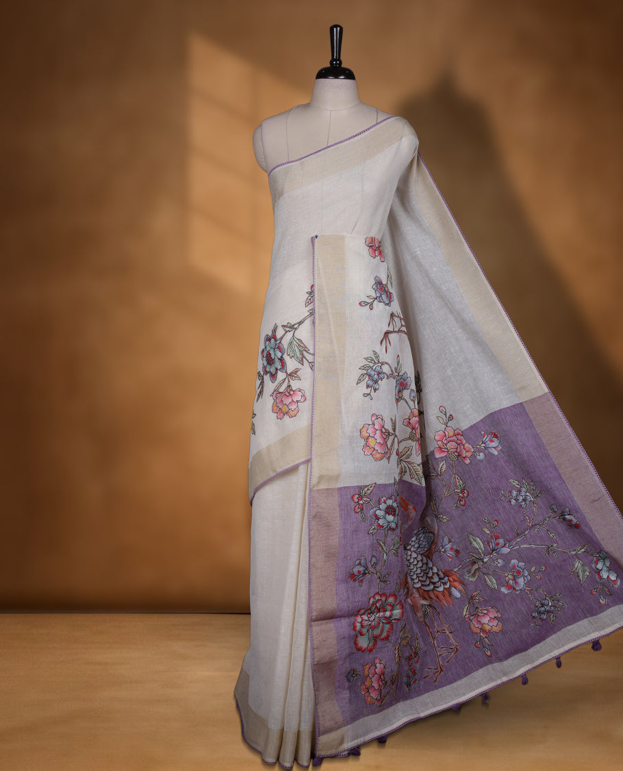 Cream colour cotton linen silk saree featuring Floral  & brids printed pattern on body, golden simple border with lavender colour pallu and comes with a matching blouse