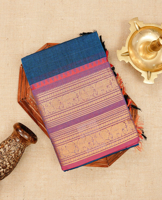 Peacock blue colour chettinad cotton saree featuring elegant plain body, Contrast magenta & purple dual shade colour with Gold zari border, comes with matching blouse piece.
