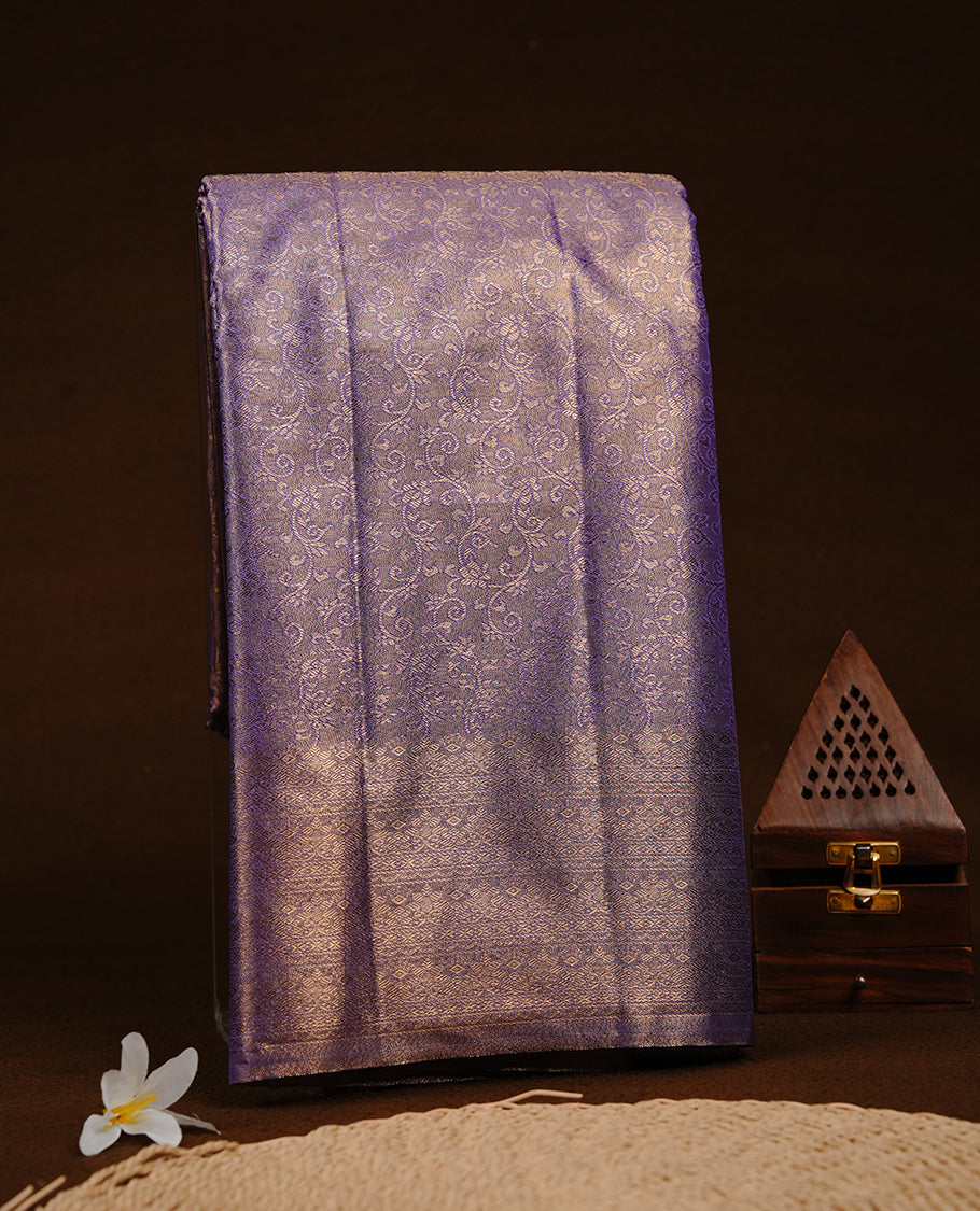 Purple & Gold colour semi tissue silk saree featuring gold zari pattern on body, self colour with gold zari traditional border, paired with matching blouse piece.