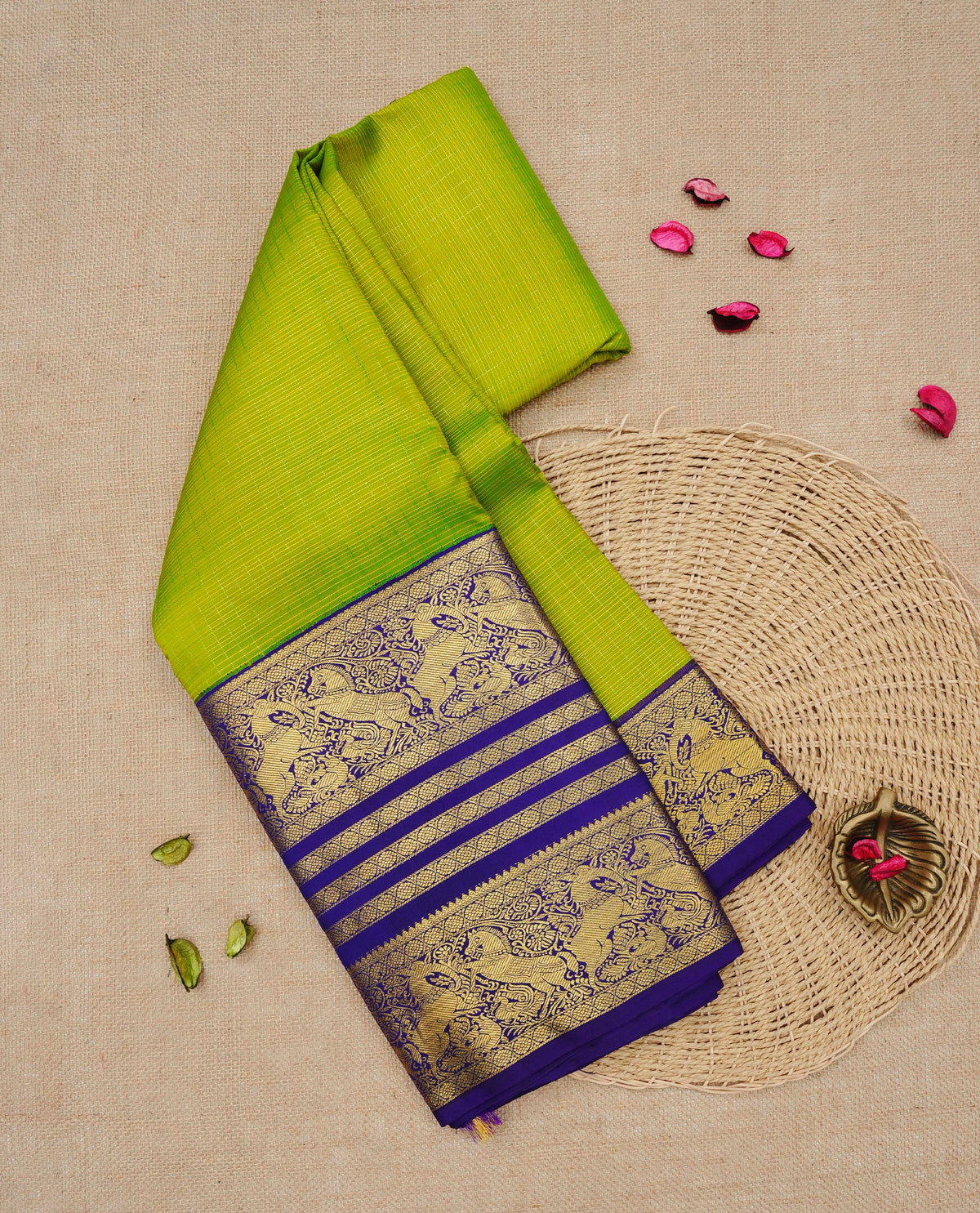 Lemon green colour Traditional Kancheepuram silk saree featuring Gold zari Delicate thin strips on body, complemented by contrast violet colour with traditional border, comes with matching blouse piece.