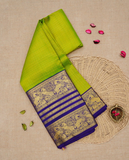 Lemon green colour Traditional Kancheepuram silk saree featuring Gold zari Delicate thin strips on body, complemented by contrast violet colour with traditional border, comes with matching blouse piece.
