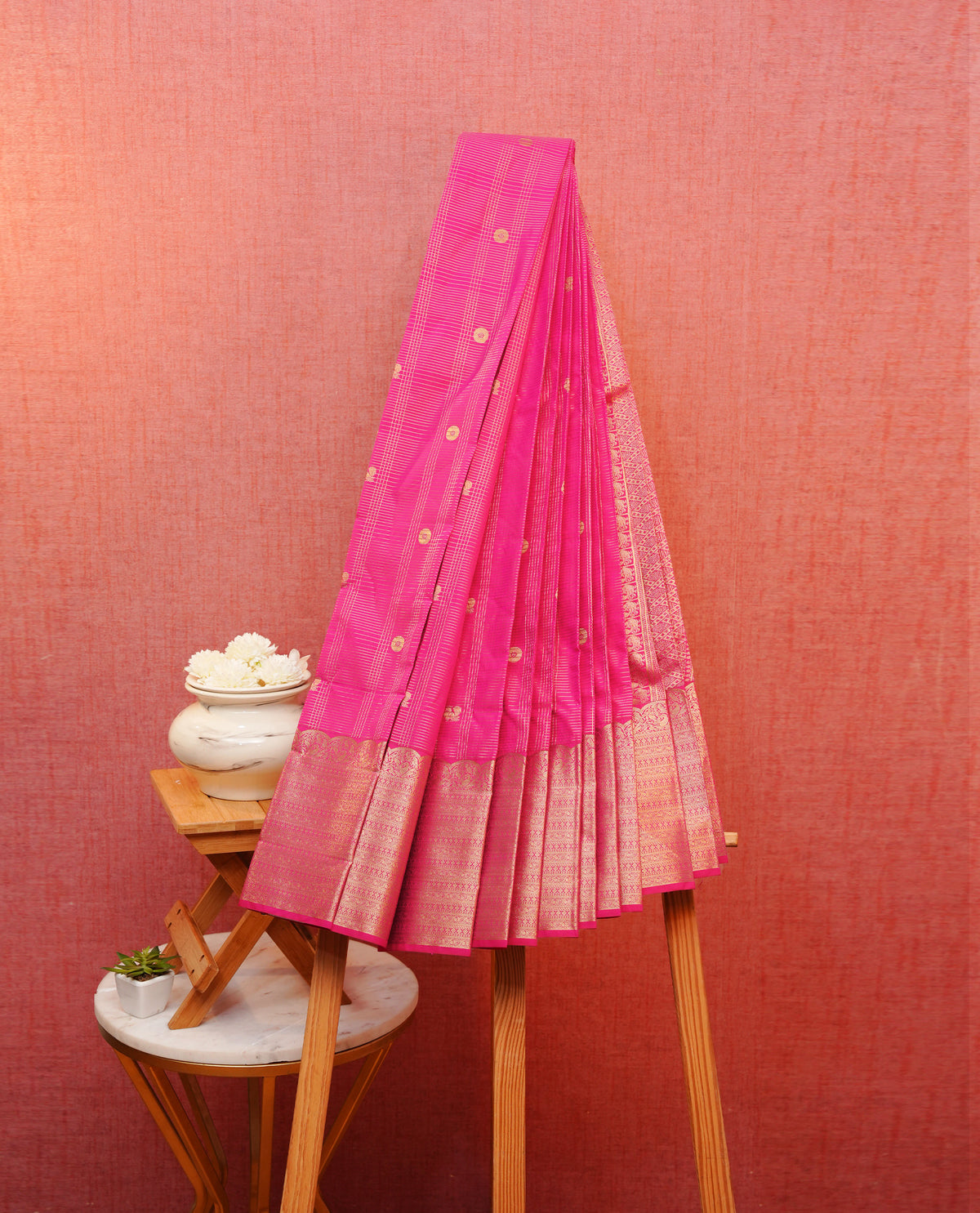 Magenta colour soft silk saree featuring gold zari checks with buttas on body, contrast by self colour gold zari peacock traditional border, grand pallu comes with matching blouse piece.