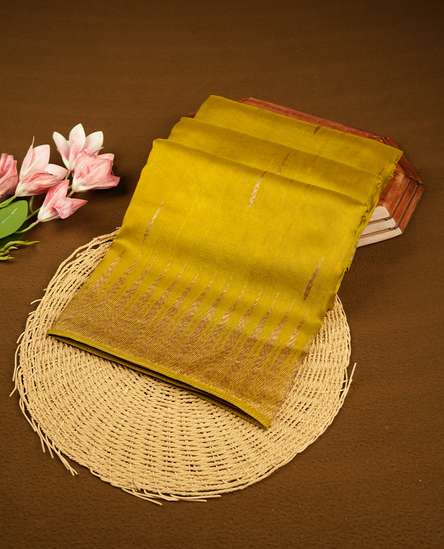 Olive colour semi banaras tussar georgette saree featuring antique gold zari buttas on body, temple pattern on border and floral pattern on pallu, paired with matching blouse piece.