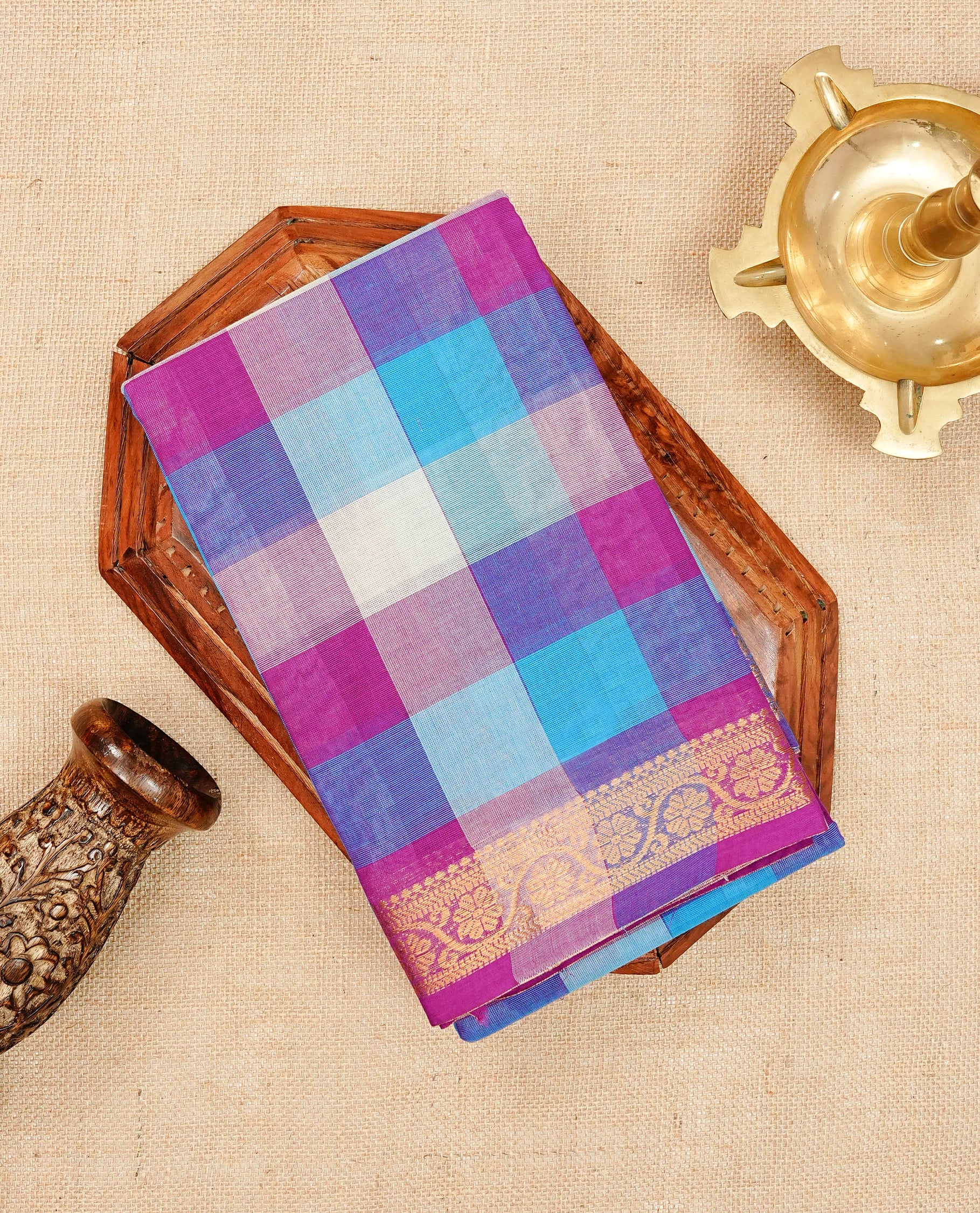 Multi colour Chettinad cotton saree featuring a check pattern on the body, complemented by a self colour with gold zari border, comes with a matching blouse piece