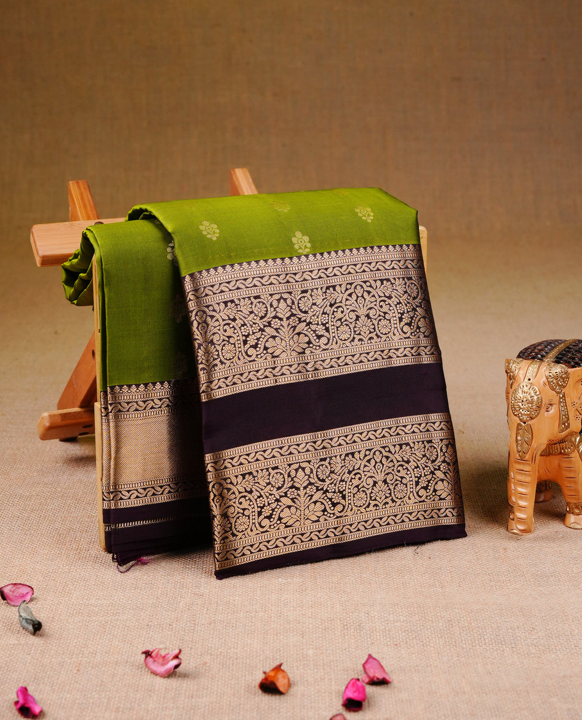 Green colour Traditional Kancheepuram Silk Saree with Elegant Gold Zari Buttas on the Body, Enhanced with a Contrast Dark Wine Colour  with Gold Zari Border and Rich Pallu, Paired with a Matching Blouse Piece.