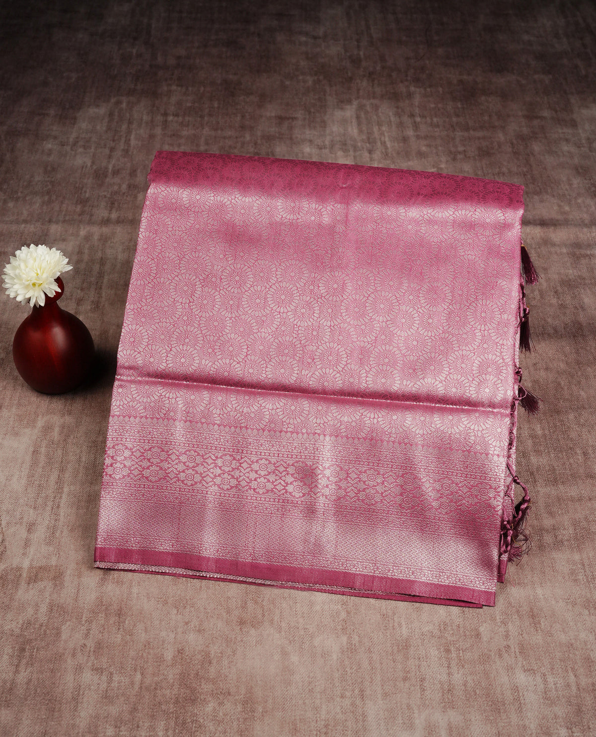 Baby pink colour softie silk saree featuring silver zari, rich pallu brocade body, with floral design & fancy border.paired with self colour matching blouse piece.