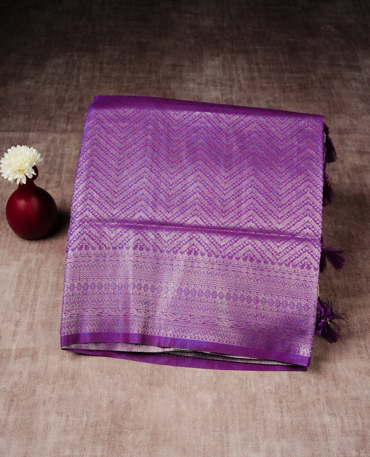 Purple colour softie silk saree featuring silver zari, rich pallu brocade body, with contrasting self colour border.paired with matching blouse piece.