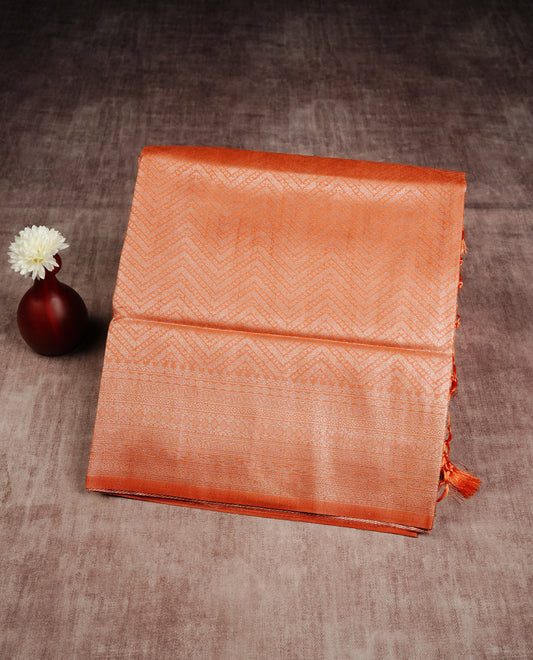 Rust orange colour softie silk saree featuring silver zari, rich pallu brocade body, with contrasting self colour border.paired with matching blouse piece.