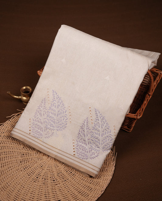 Beige colour Tussar silk saree featuring Elegant plain body, highlighting Lavender colour Leaf cut work with Light gold zari border, pallu and paired with matching blouse piece.