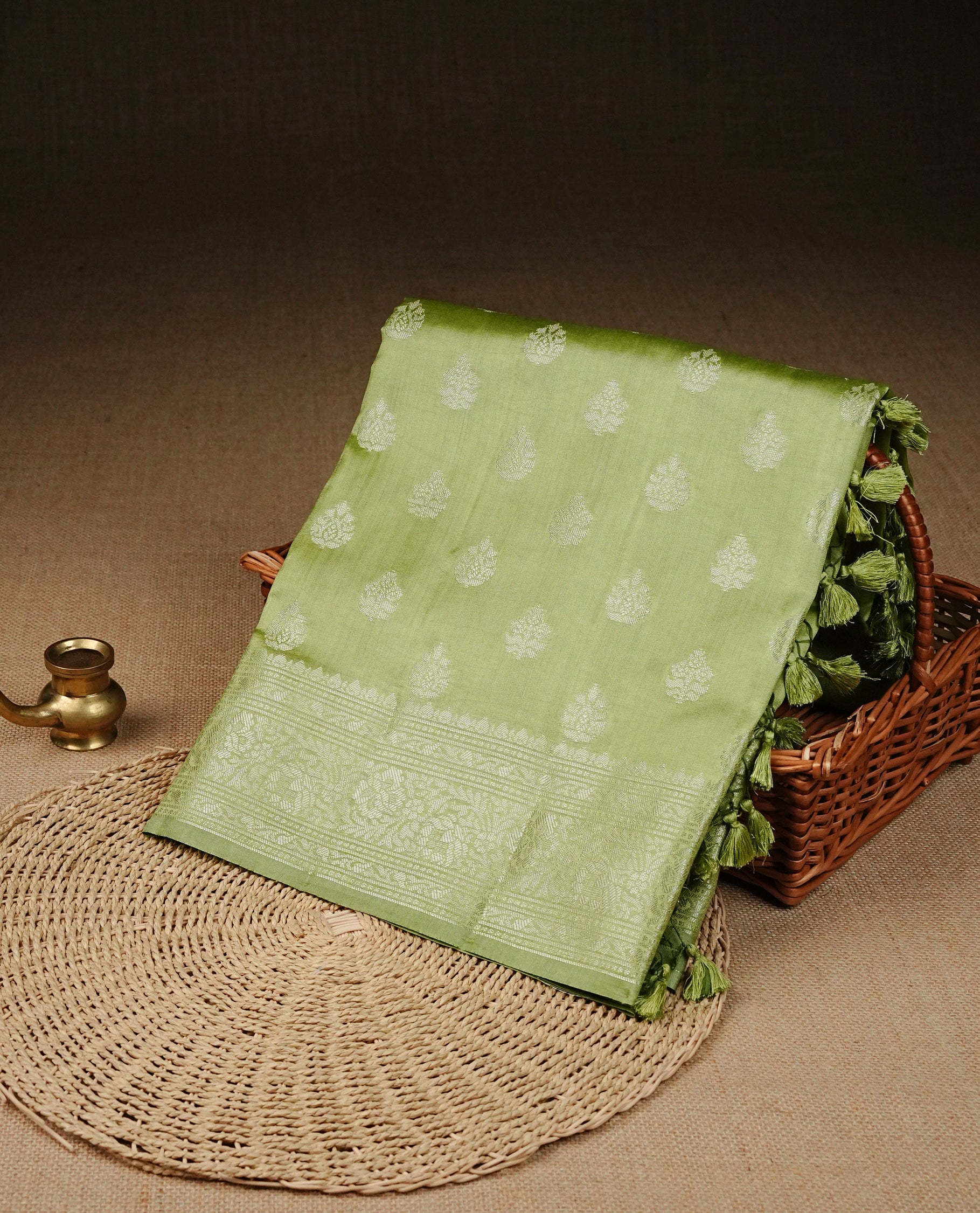 Pastel Gren Colour Tussar silk saree with silver zari buttas On Body, a Contrast  Self Coloured zari border and pallu, Paired With a matching blouse piece.