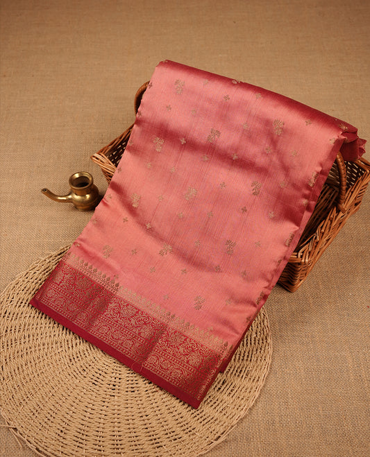 Coral colour Pure banaras soft silk saree featuring Antique zari motifs on body, contrast Deep red colour border , traditional pallu and paired with matching blouse