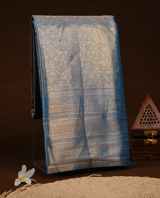 Blue & Gold colour semi tissue silk saree featuring gold zari pattern on body, self colour with gold zari traditional border, paired with matching blouse piece.