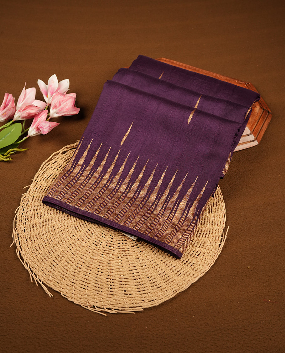 Grape colour semi banaras tussar georgette saree featuring antique gold zari buttas on body, temple pattern on border and floral pattern on pallu, paired with matching blouse piece.