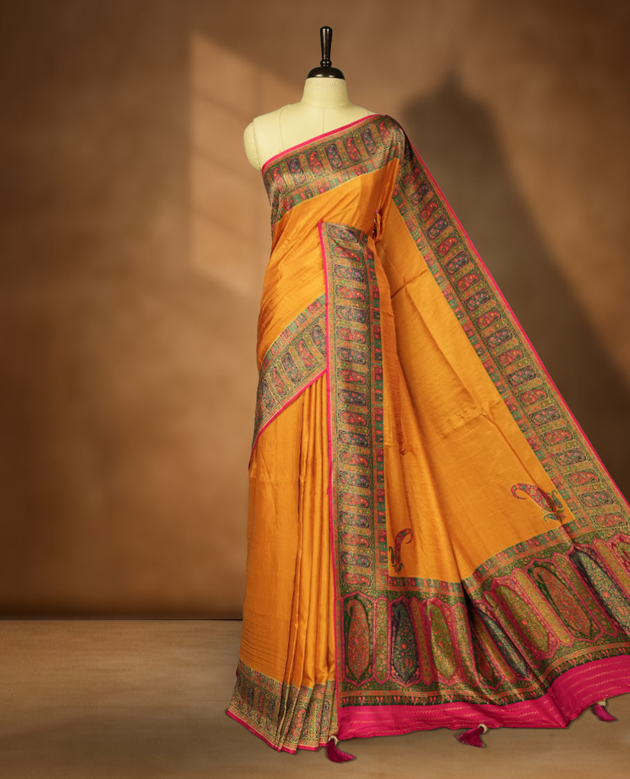 Orange Pashmina Silk Saree with Plain Body, Adorned with Intricate Multicolor Paisley and Floral Motifs on Elegant Pink-Green Zari Border & Rich Pallu, Paired with Matching Blouse Piece
