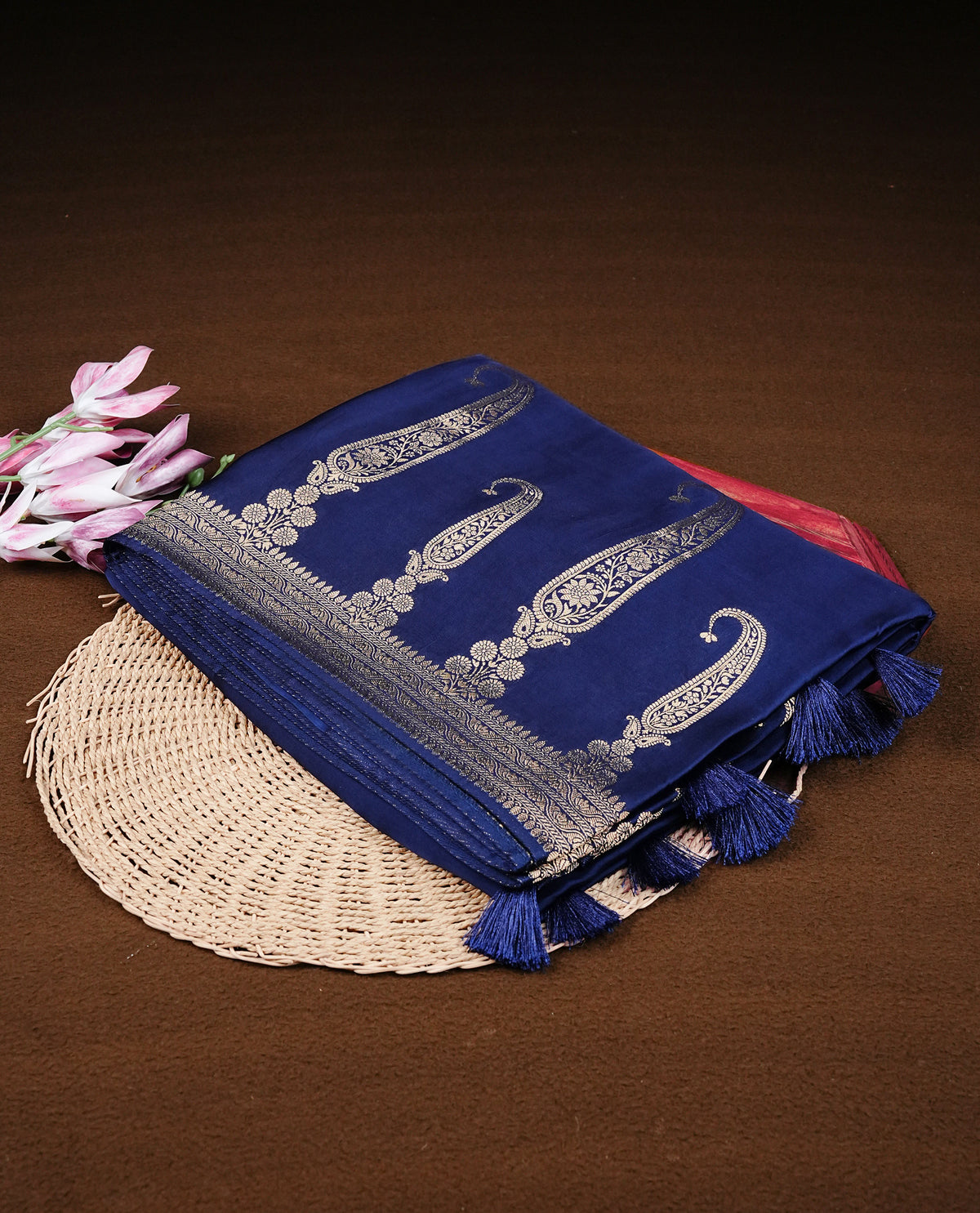 Navy blue colour Banaras satin crepe silk saree featuring Plain body, associate with Gold zari traditional border, comes with matching blouse piece.