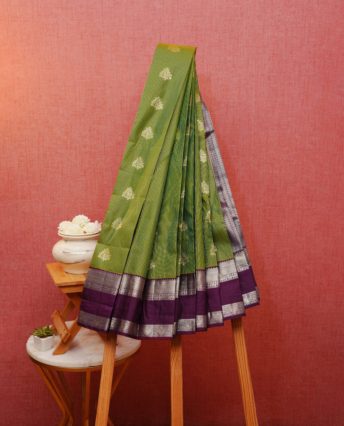 Mehndi Green colour silk saree featuring gold zari checks on body, contrast purple with gold zari traditional border, contrast grand pallu comes with matching blouse piece .
