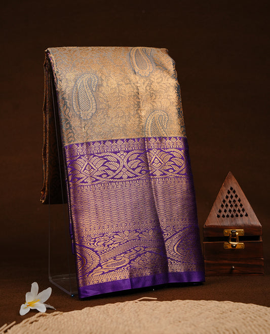 Blue & gold double shade colour semi tissue silk saree featuring gold zari floral kodi pattern on body, contrast indigo colour with gold zari traditional border, paired with matching blouse piece.