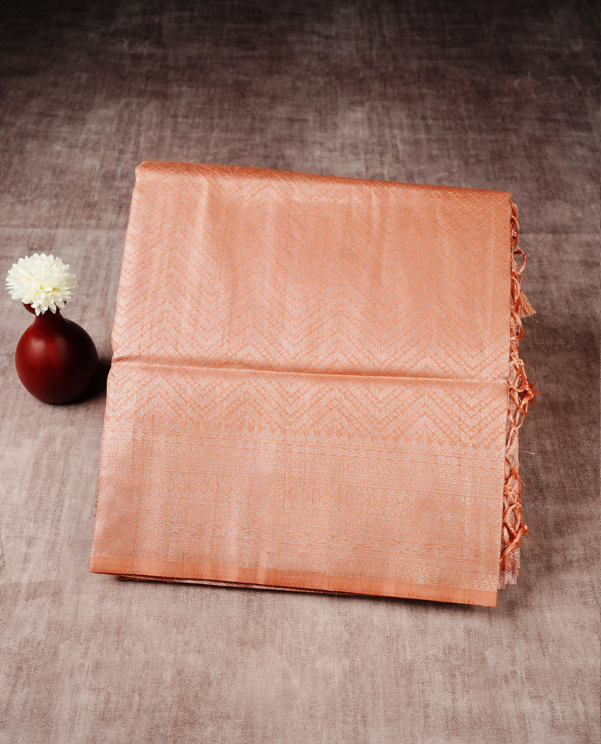 Peach colour softie silk saree featuring silvar zari, rich pallu floral pattern brocade body, with contrasting self colour border.paired with matching blouse piece.