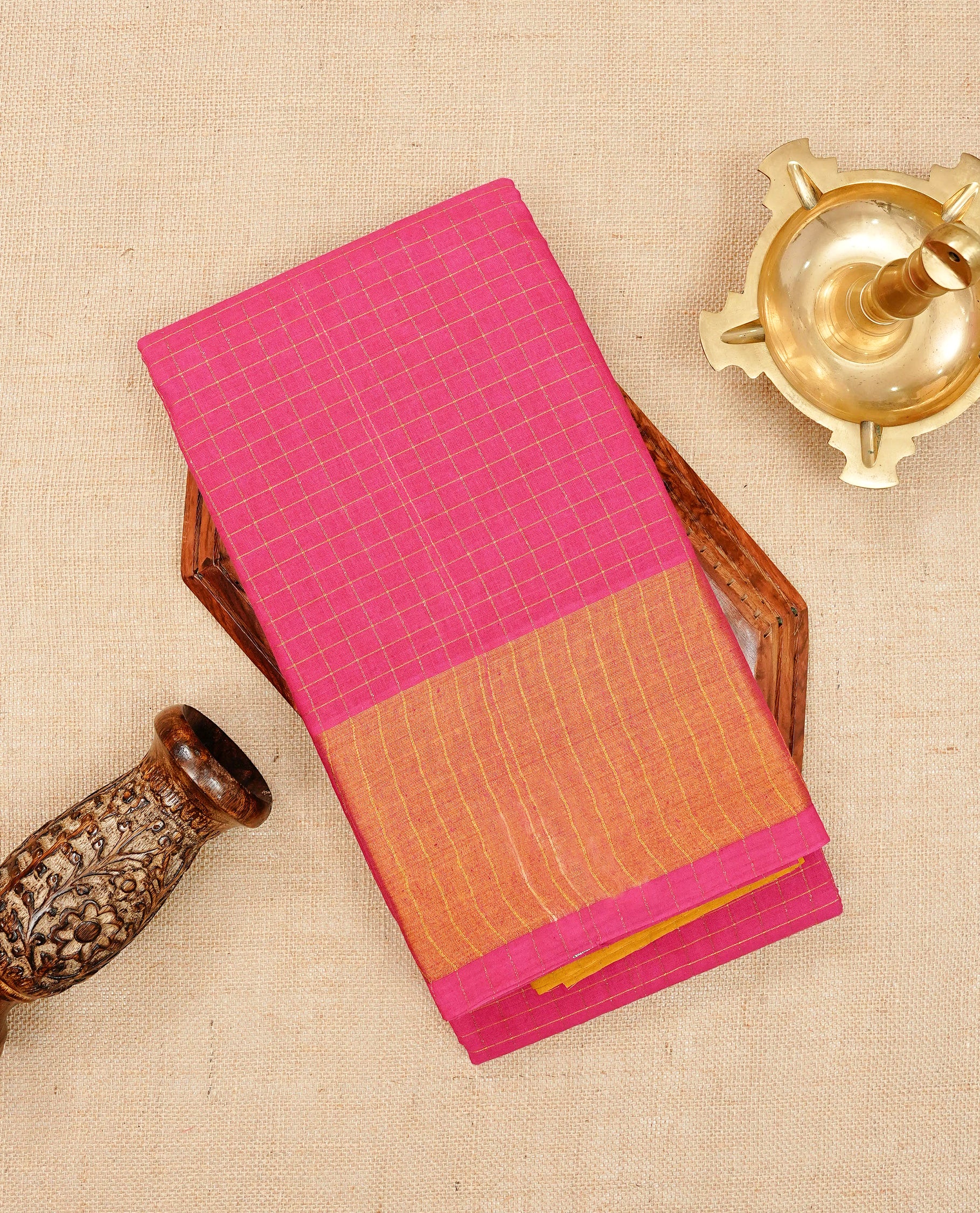 Pink Sungudi cotton saree featuring elegant gold zari checks across the body, complemented by a contrast gold zari border. Comes with a matching blouse piece.