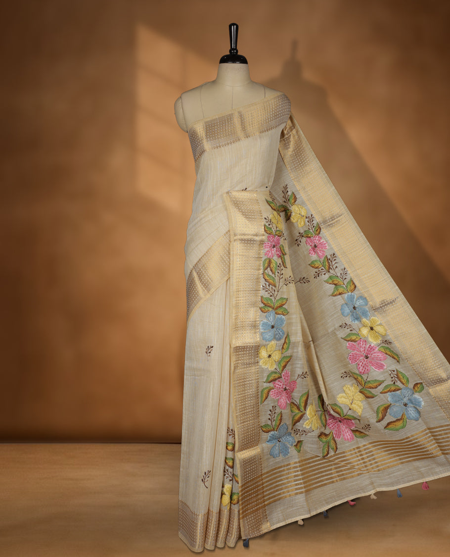 Beige colour Banarasi linen silk saree featuring hand brushed colour with Floral  & birds printed pattern on body, gold zari woven geometric design border with self colour pallu and comes with a matching blouse