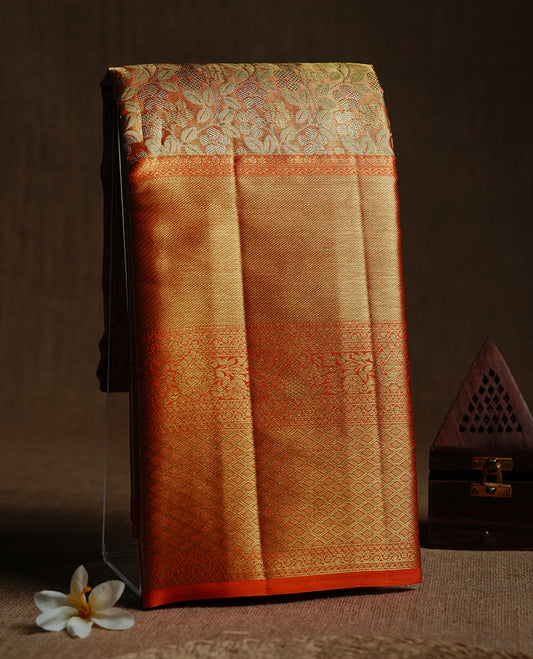 Gold & orange double shade colour kancheepuram tissue silk saree featuring gold zari floral kodi pattern on body, complemented by contrast orange colour with traditional border, paired with matching blouse piece.