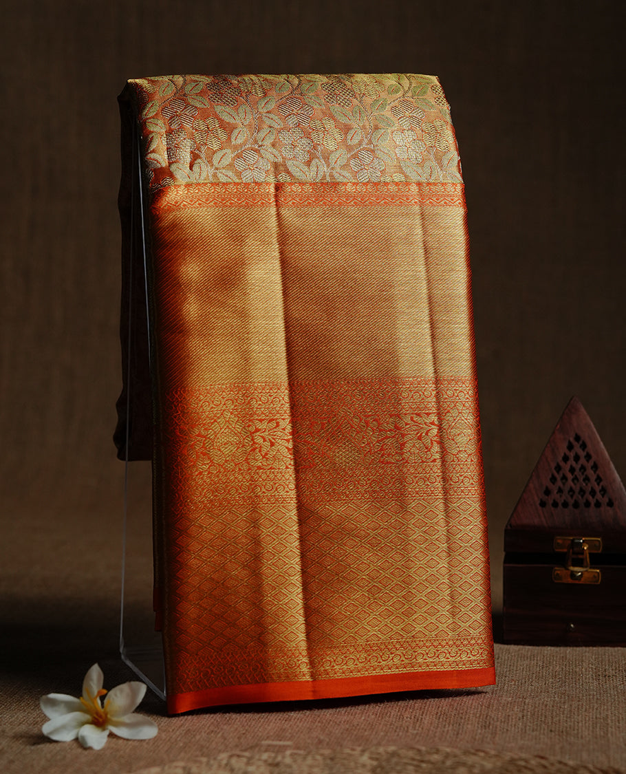 Gold & orange double shade colour kancheepuram tissue silk saree featuring gold zari floral kodi pattern on body, complemented by contrast orange colour with traditional border, paired with matching blouse piece.