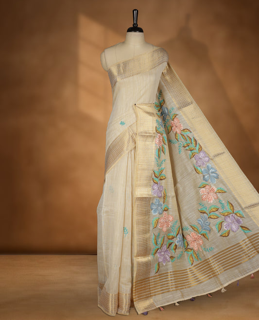 Beige colour Banarasi linen silk saree featuring hand brushed colour with Floral  & birds printed pattern on body, gold zari woven geometric design border with self colour pallu and comes with a matching blouse