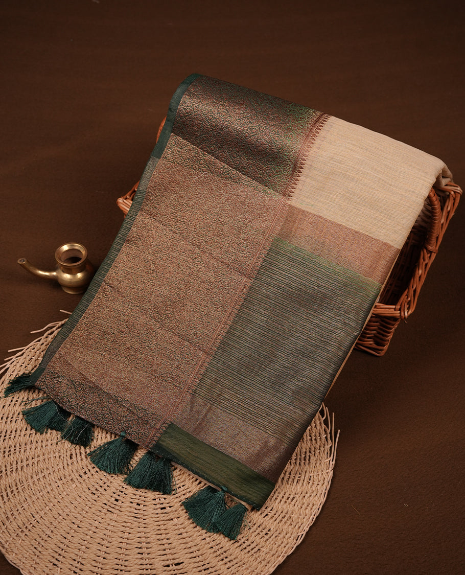 Light gold colour semi linen silk saree featuring elegant plain body, highlighting antique zari traditional border with contrast green colour, pallu and paired with matching blouse