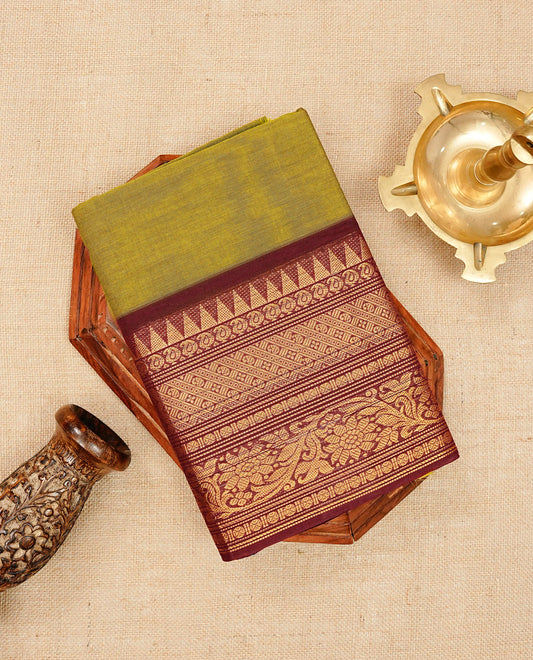 Olive colour chettinad cotton saree featuring elegant plain body, Contrast maroon colour with Gold zari border, comes with matching blouse piece.