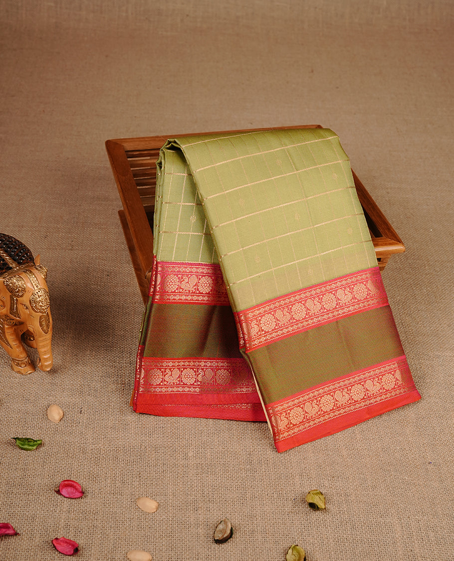 Light Olive colour traditional kancheepuram silk saree featuring gold zari check pattern on body, complemented by contrast red colour with gold zari traditional border, paired with matching blouse piece.