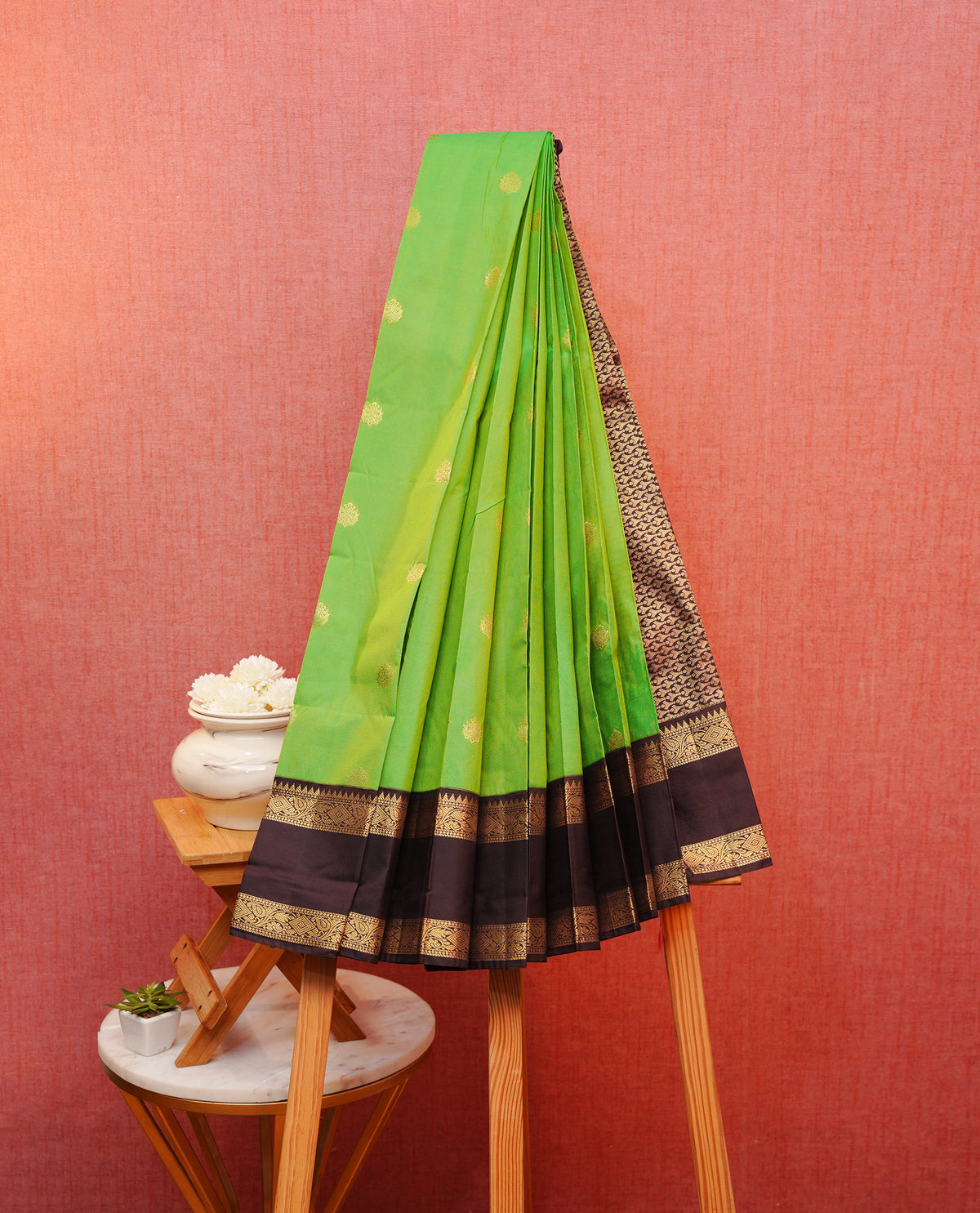 Green colour silk saree featuring gold zari motifs on body, contrast brown with gold zari traditional border, contrast grand pallu comes with matching blouse piece .
