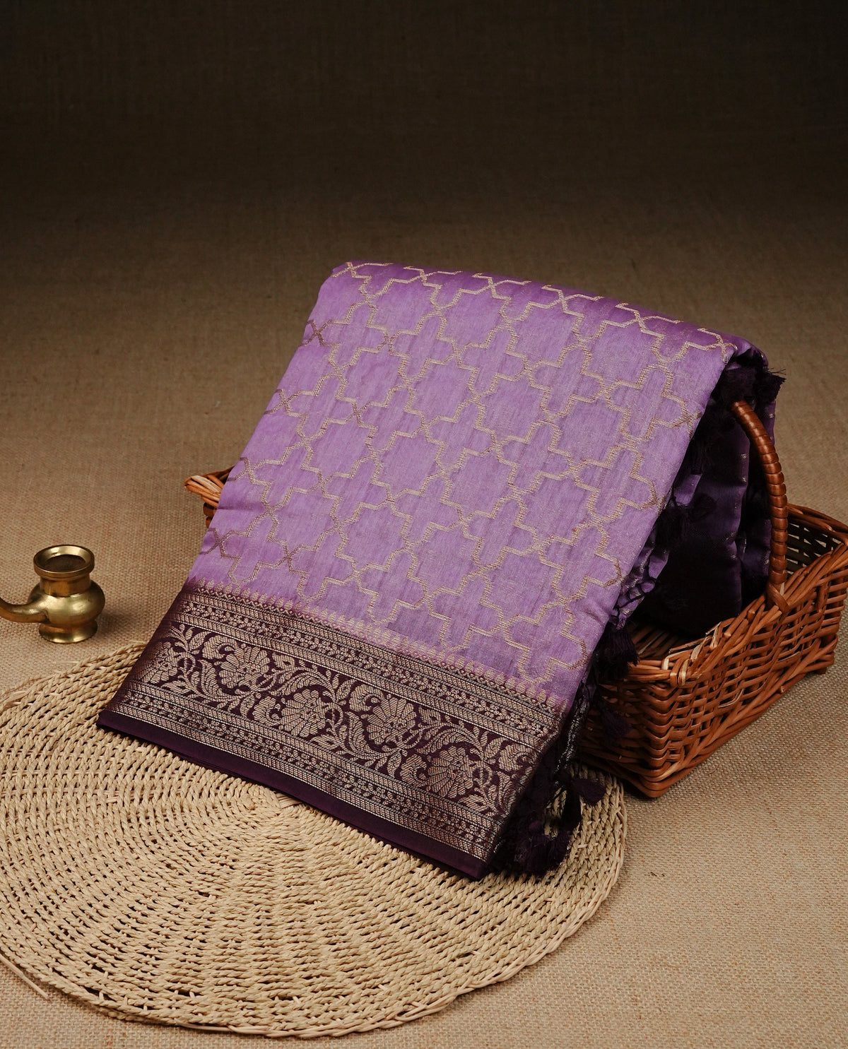 Light purple colour banaras silk saree featuring Gold zari geometric pattern on body, complemented by contrast Purple colour border with gold zari, comes with matching blouse piece.