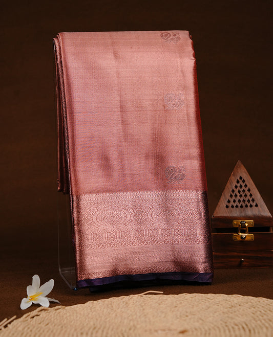 Copper colour semi tissue silk saree featuring copper zari pattern on body, contrast Purple colour with gold zari traditional border, paired with matching blouse piece.