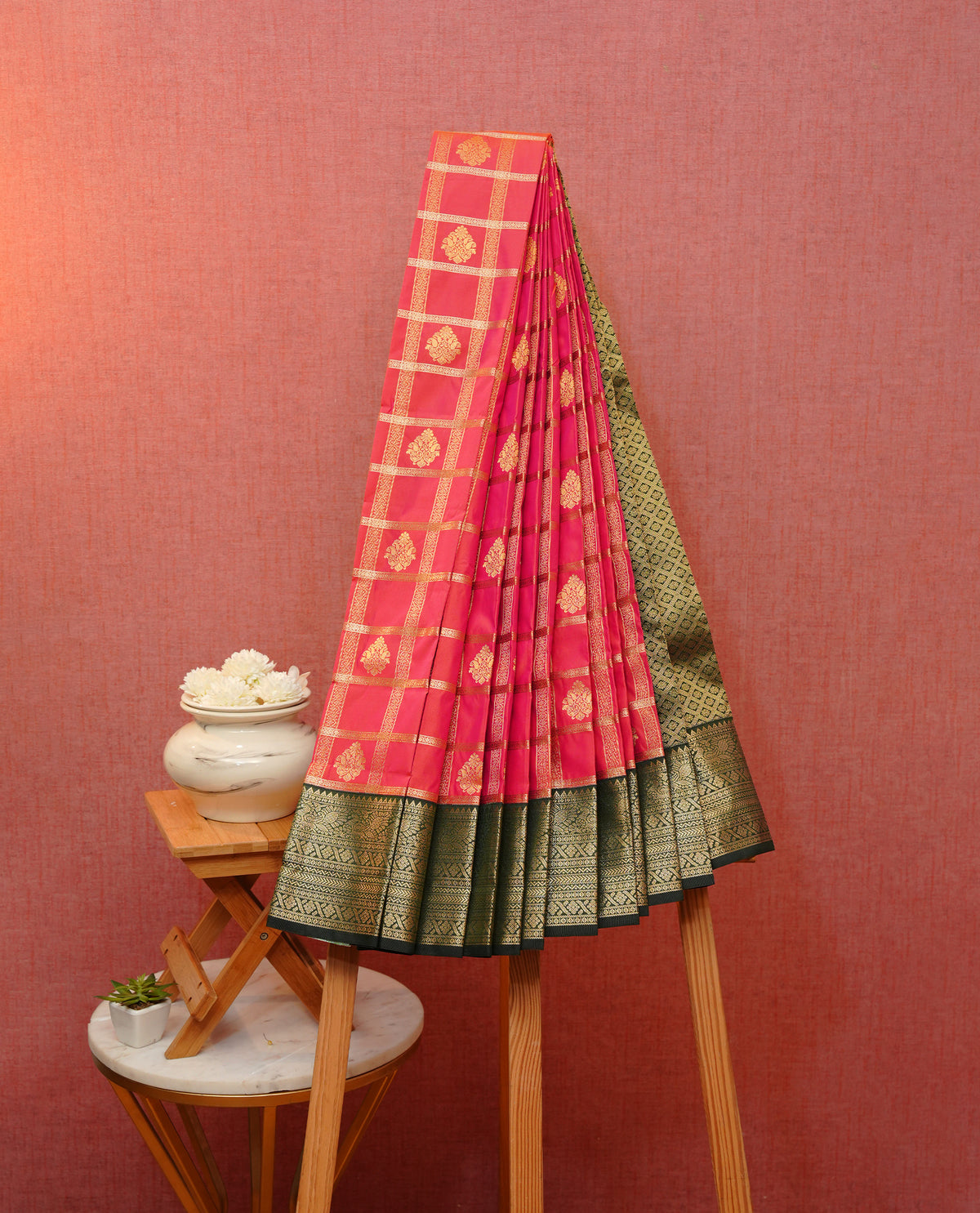 Orange & pink double shade soft silk saree featuring gold zari checks with motifs on body, contrast dark green colour  gold zari traditional border, grand pallu comes with matching blouse piece.