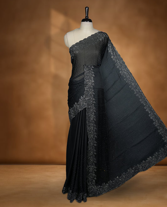 Black Colour Chiffon Designer Saree featuring Delicate White Stone Work All Over the Body, with Stone Detailing on the Border and Pallu, paired with a Matching Blouse.