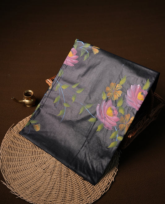 Black colour  Pure tusser silk saree featuring multicolour floral hand print designs all over body without border, pallu, paired with matching blouse piece.