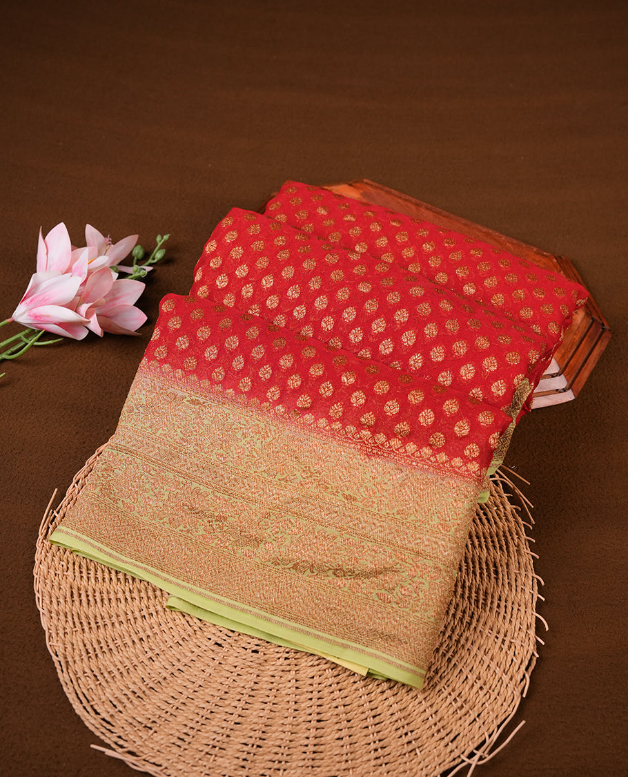 Maroon colour pure Banarasi Crepe saree featuring Antique zari Flower Motifs all over the body, complemented by an contrast Light green dye colour with gold zari Floral Kodi Worked border and pallu, with matching blouse.